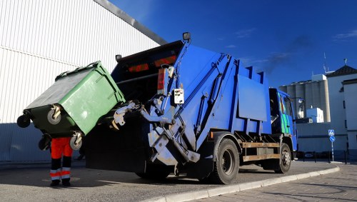 Professionals conducting loft clearance in a Catford home