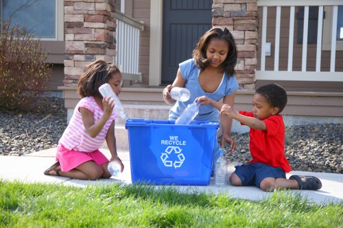 Recycling bins and sorted materials in a business premises