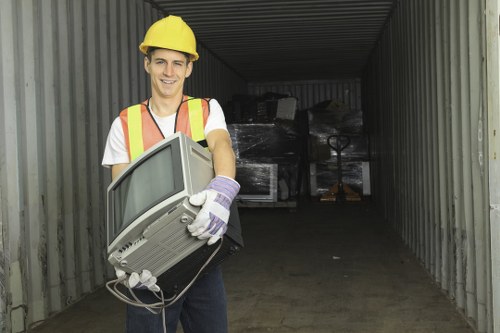 Workers wearing PPE during a waste clearance